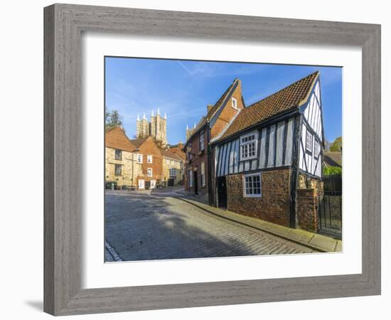 Lincoln Cathedral and timbered architecture viewed from the cobbled Steep Hill, Lincoln, Lincolnshi-Frank Fell-Framed Photographic Print