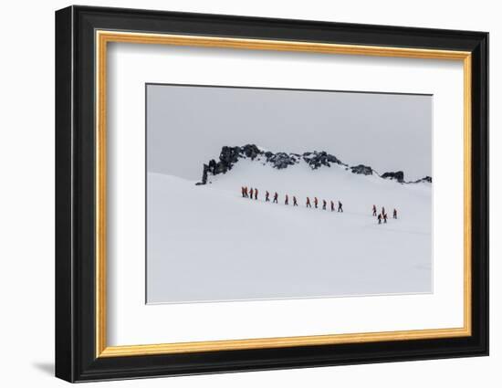 Lindblad Expeditions Guests from the National Geographic Explorer Hiking at Orne Harbor, Antarctica-Michael Nolan-Framed Photographic Print