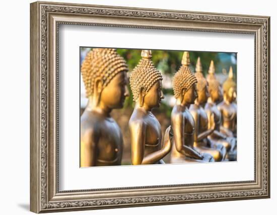 Line of Buddha statues, Seema Malaka temple on Beira Lake. Colombo, Sri Lanka-Peter Adams-Framed Photographic Print