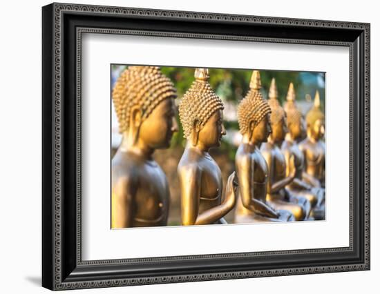 Line of Buddha statues, Seema Malaka temple on Beira Lake. Colombo, Sri Lanka-Peter Adams-Framed Photographic Print