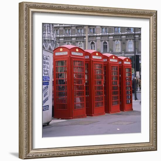 Line of Four Red Telephone Boxes at Charing Cross, London, England, United Kingdom, Europe-Roy Rainford-Framed Photographic Print