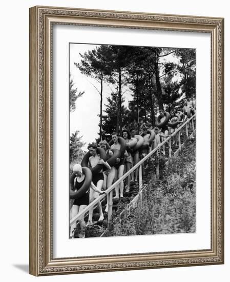 Line of Fun Seekers with Inner Tubes Descending Staircase to Pier for Floating Party on Apple River-Alfred Eisenstaedt-Framed Photographic Print