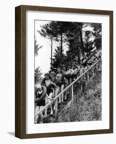 Line of Fun Seekers with Inner Tubes Descending Staircase to Pier for Floating Party on Apple River-Alfred Eisenstaedt-Framed Photographic Print