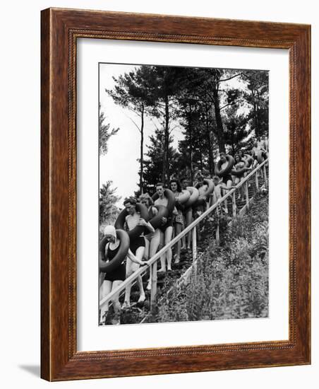 Line of Fun Seekers with Inner Tubes Descending Staircase to Pier for Floating Party on Apple River-Alfred Eisenstaedt-Framed Photographic Print