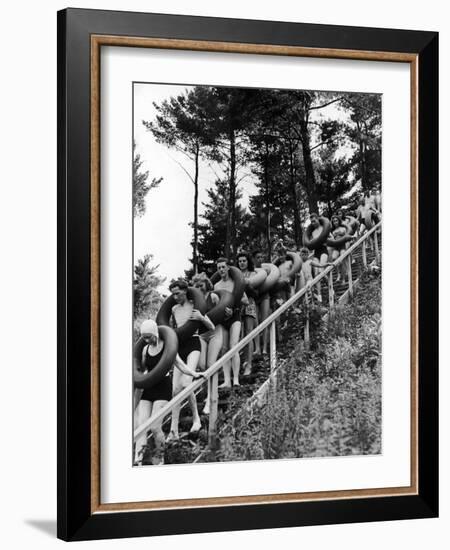 Line of Fun Seekers with Inner Tubes Descending Staircase to Pier for Floating Party on Apple River-Alfred Eisenstaedt-Framed Photographic Print