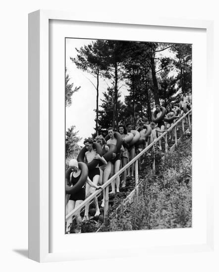 Line of Fun Seekers with Inner Tubes Descending Staircase to Pier for Floating Party on Apple River-Alfred Eisenstaedt-Framed Photographic Print