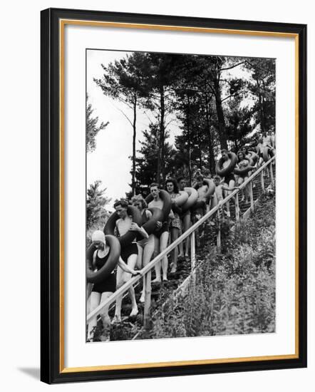 Line of Fun Seekers with Inner Tubes Descending Staircase to Pier for Floating Party on Apple River-Alfred Eisenstaedt-Framed Photographic Print