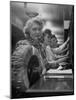 Line of Operators at Macy's Main Switchboard, with Alice Lennon Flipping Through a Rolodex File-Nina Leen-Mounted Photographic Print