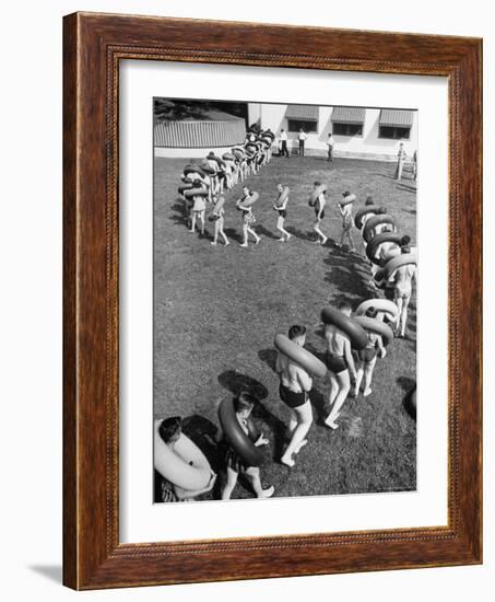 Line of People Making Snakelike Pattern as They Head for Inner Tube Floating Party on Apple River-Alfred Eisenstaedt-Framed Photographic Print