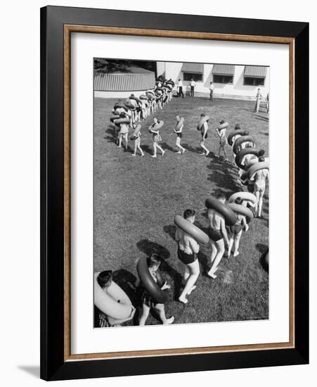 Line of People Making Snakelike Pattern as They Head for Inner Tube Floating Party on Apple River-Alfred Eisenstaedt-Framed Photographic Print