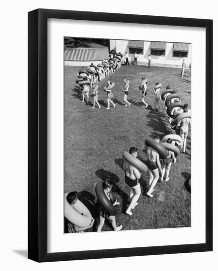 Line of People Making Snakelike Pattern as They Head for Inner Tube Floating Party on Apple River-Alfred Eisenstaedt-Framed Photographic Print