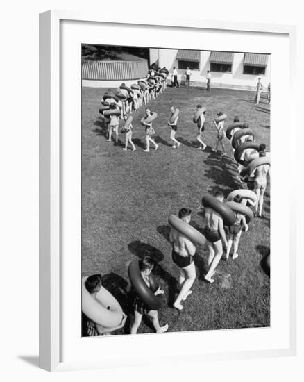 Line of People Making Snakelike Pattern as They Head for Inner Tube Floating Party on Apple River-Alfred Eisenstaedt-Framed Photographic Print