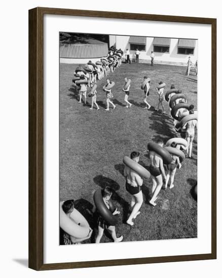 Line of People Making Snakelike Pattern as They Head for Inner Tube Floating Party on Apple River-Alfred Eisenstaedt-Framed Photographic Print