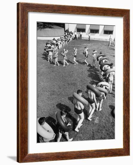 Line of People Making Snakelike Pattern as They Head for Inner Tube Floating Party on Apple River-Alfred Eisenstaedt-Framed Photographic Print