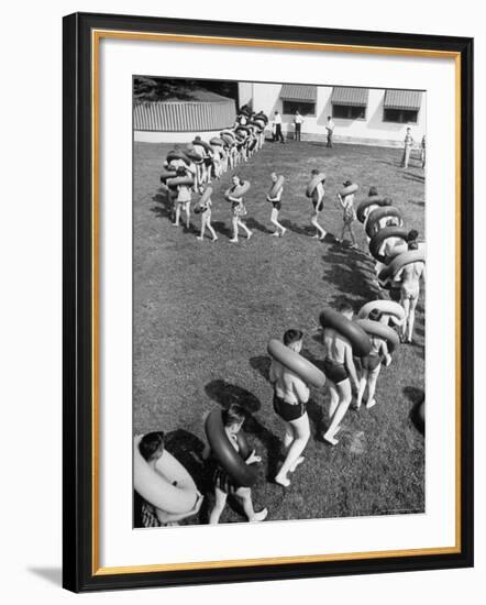 Line of People Making Snakelike Pattern as They Head for Inner Tube Floating Party on Apple River-Alfred Eisenstaedt-Framed Photographic Print