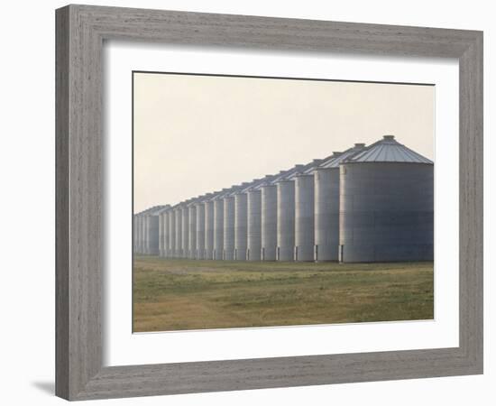 Line of Storage Bins for Corn, Unidentified Section of the Mid-West-John Zimmerman-Framed Photographic Print