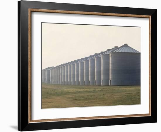 Line of Storage Bins for Corn, Unidentified Section of the Mid-West-John Zimmerman-Framed Photographic Print