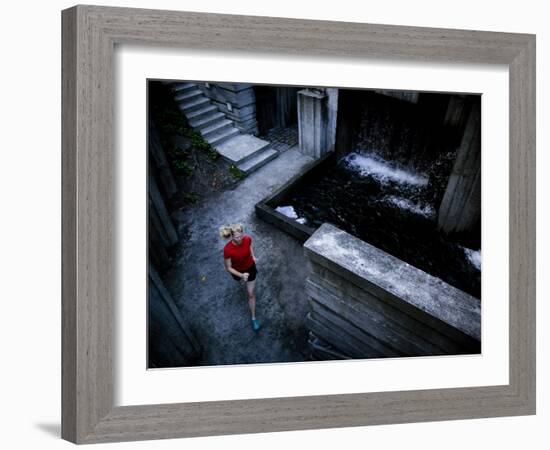 Lisa Eaton Goes for an Early Morning Run in Freeway Park - Seattle, Washington-Dan Holz-Framed Photographic Print