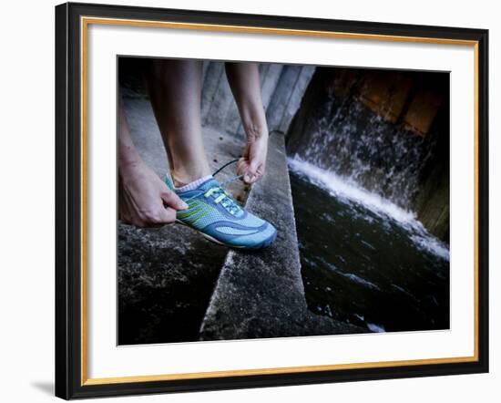 Lisa Eaton Laces Up Her Running Shoe Near a Water Feature at Freeway Park - Seattle, Washington-Dan Holz-Framed Photographic Print