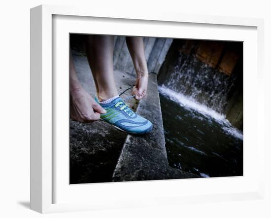 Lisa Eaton Laces Up Her Running Shoe Near a Water Feature at Freeway Park - Seattle, Washington-Dan Holz-Framed Photographic Print