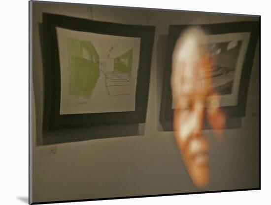 Lithograph by Nelson Mandela is Seen Reflected on a Photographic Portrait of Mandela-null-Mounted Photographic Print
