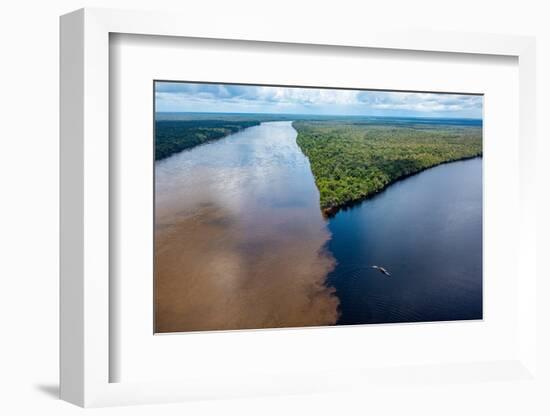 Little boat on the meeting point of the Casiquiare River and black Pasimoni River-Michael Runkel-Framed Photographic Print