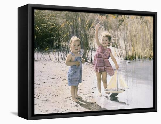 Little Boy and Girl Playing with Toy Sail Boat-Nora Hernandez-Framed Premier Image Canvas