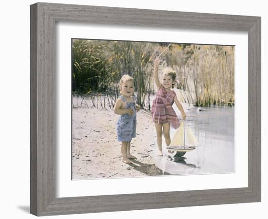 Little Boy and Girl Playing with Toy Sail Boat-Nora Hernandez-Framed Giclee Print