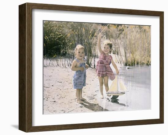 Little Boy and Girl Playing with Toy Sail Boat-Nora Hernandez-Framed Giclee Print