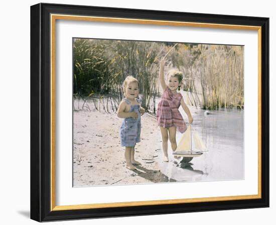 Little Boy and Girl Playing with Toy Sail Boat-Nora Hernandez-Framed Giclee Print