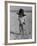 Little Boy at the Beach Wearing a Oversized Cowboy Hat Playing with a Toy Pistol-Ralph Crane-Framed Photographic Print
