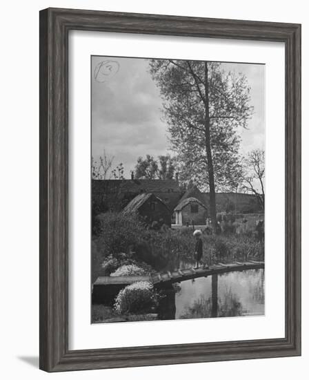 Little Boy Crossing the Bridge over the Stream at Winson Mill Farm, A War Nursery-Hans Wild-Framed Photographic Print