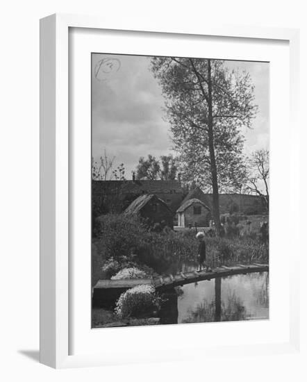 Little Boy Crossing the Bridge over the Stream at Winson Mill Farm, A War Nursery-Hans Wild-Framed Photographic Print