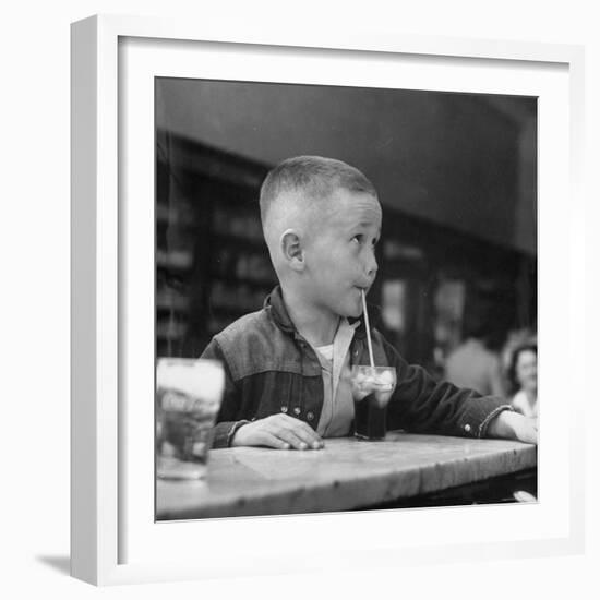 Little Boy Drinking a Soda at a Local Drugstore-Francis Miller-Framed Photographic Print