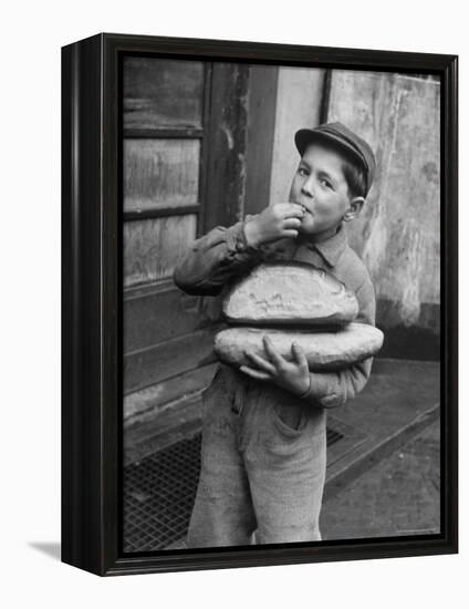 Little Boy Holding Loaves of Bread-Walter Sanders-Framed Premier Image Canvas