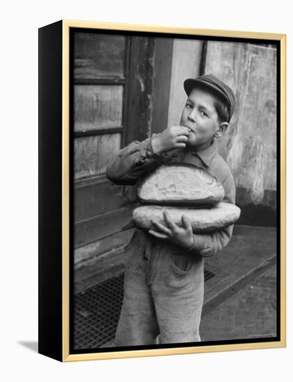 Little Boy Holding Loaves of Bread-Walter Sanders-Framed Premier Image Canvas