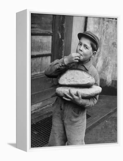 Little Boy Holding Loaves of Bread-Walter Sanders-Framed Premier Image Canvas