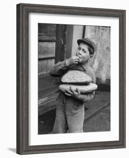 Little Boy Holding Loaves of Bread-Walter Sanders-Framed Photographic Print