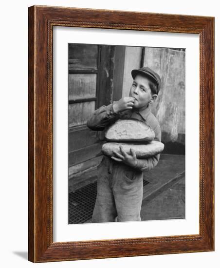 Little Boy Holding Loaves of Bread-Walter Sanders-Framed Photographic Print