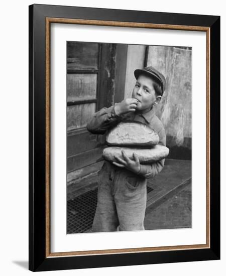 Little Boy Holding Loaves of Bread-Walter Sanders-Framed Photographic Print