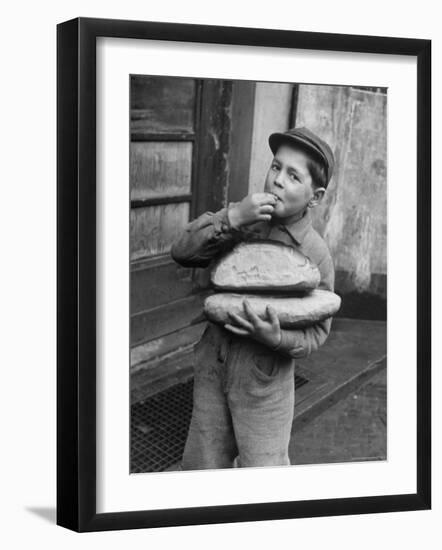 Little Boy Holding Loaves of Bread-Walter Sanders-Framed Photographic Print