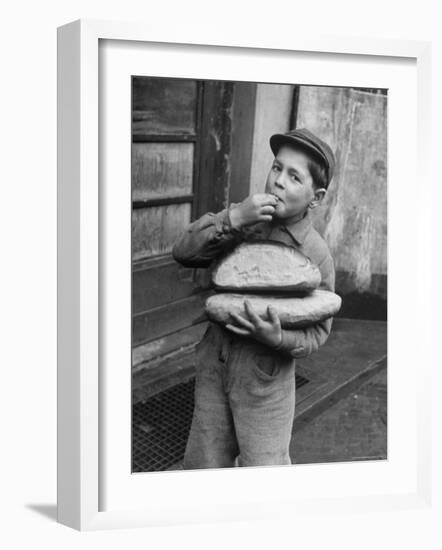 Little Boy Holding Loaves of Bread-Walter Sanders-Framed Photographic Print