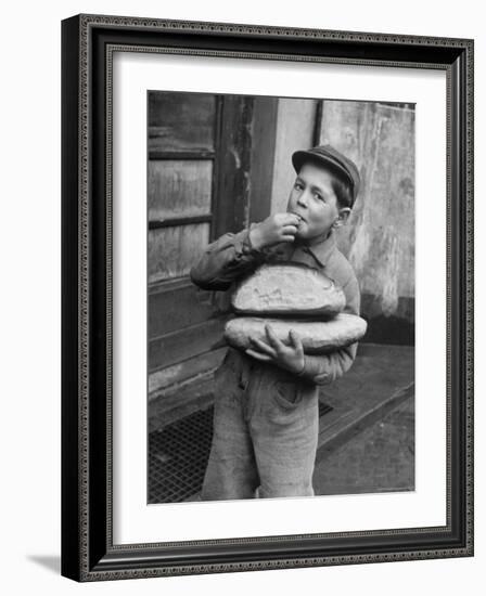 Little Boy Holding Loaves of Bread-Walter Sanders-Framed Photographic Print