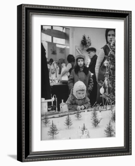 Little Boy Looking at Train Set in Moscow Department Store-James Whitmore-Framed Photographic Print