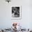 Little Boy on Merry Go Round at the Tuileries Gardens, Sticking Out His Tongue-Alfred Eisenstaedt-Framed Photographic Print displayed on a wall