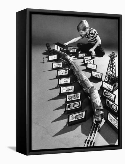 Little Boy Playing with a Toy Train and Billboard Set-Walter Sanders-Framed Premier Image Canvas