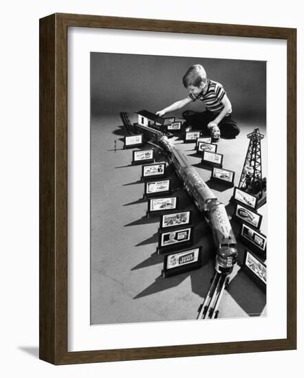 Little Boy Playing with a Toy Train and Billboard Set-Walter Sanders-Framed Photographic Print