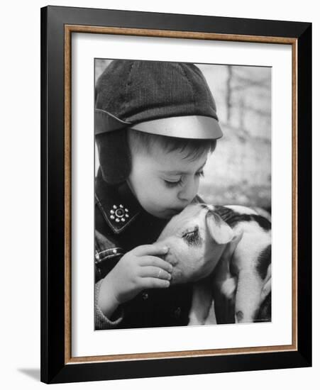 Little Boy Playing with Piglet on Farm in Kansas-Francis Miller-Framed Photographic Print