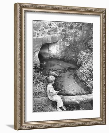 Little Boy Sitting on a Felled Tree, Fishing-Cornell Capa-Framed Photographic Print