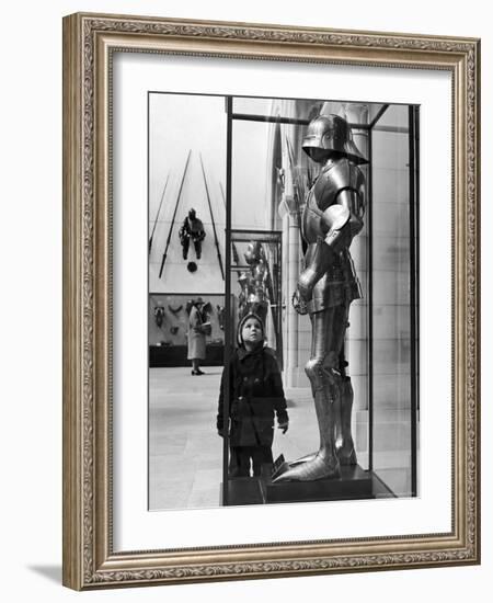 Little Boy Staring Up at Medieval Suit of Armor in the Metropolitan Museum of Art-Alfred Eisenstaedt-Framed Photographic Print